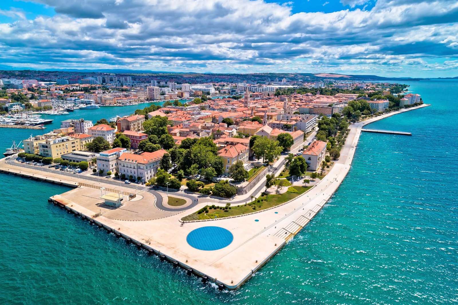 Zadar waterfront with ancient Roman ruins and the Sea Organ beside the sea